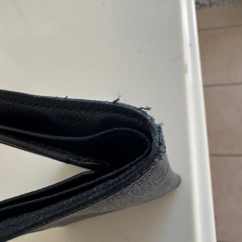 Authentic Men Louis Vuitton wallet good condition some threads are exposed.
